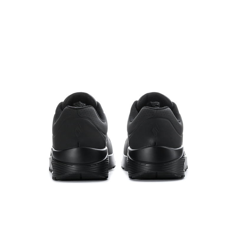 Men's black wide sneakers from the heel view with supportive rear collar and cushioned sole