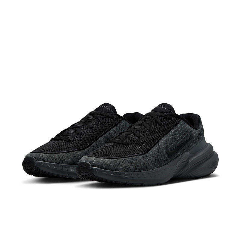 Black men’s running sneaker, side view with laced mesh upper and thick outsole