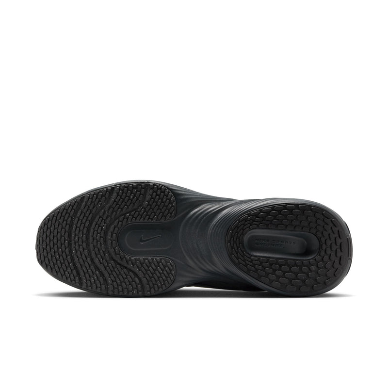 Black sneaker outsole with textured tread and raised traction pods