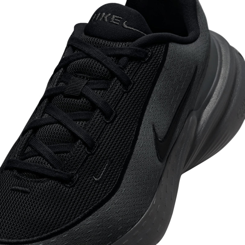 Close-up of black laces and textured upper with Nike Swoosh on the side