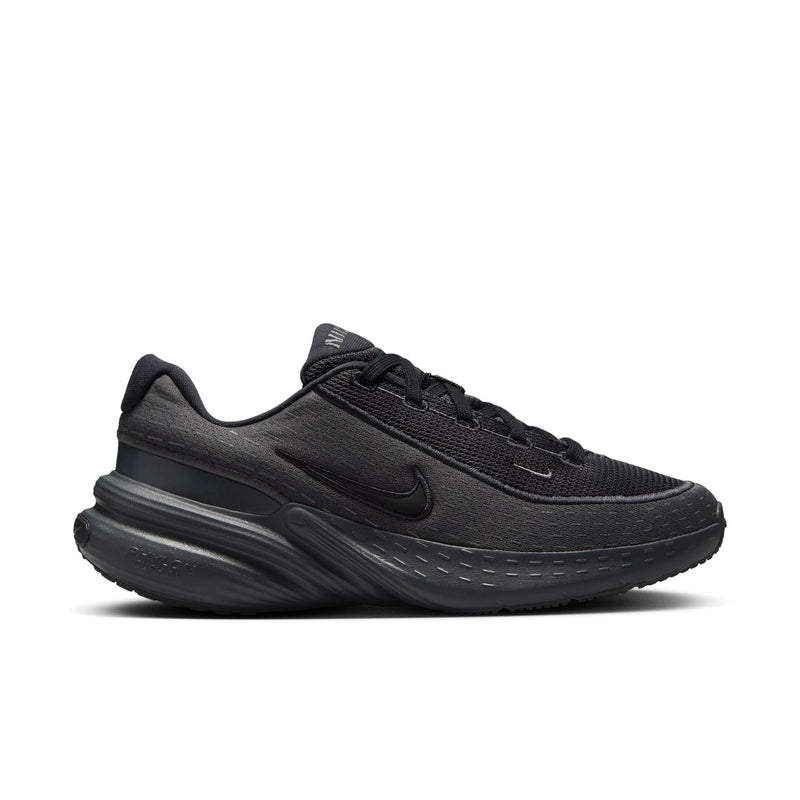 Women's black knit running shoes with lace-up, Nike swoosh, and cushioned midsole