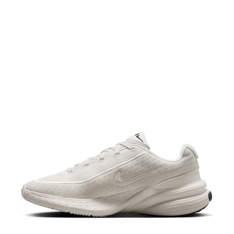 White lace-up sneakers with Nike Swoosh and sculpted midsole