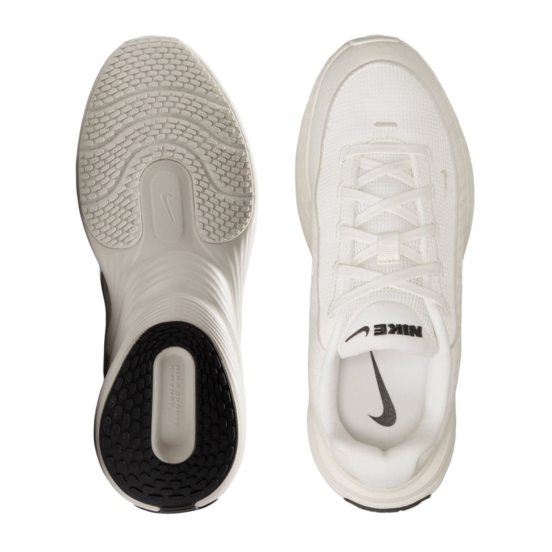 Shoe outsole and heel view: light sole with black traction panel