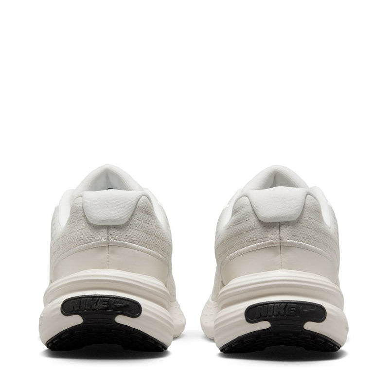 Back view of white sneakers with cushioned collar and black heel logo accents