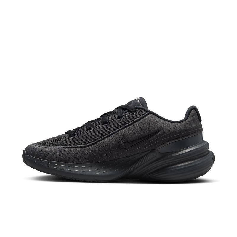 Women's black knit running shoes, side view with Nike swoosh and padded collar