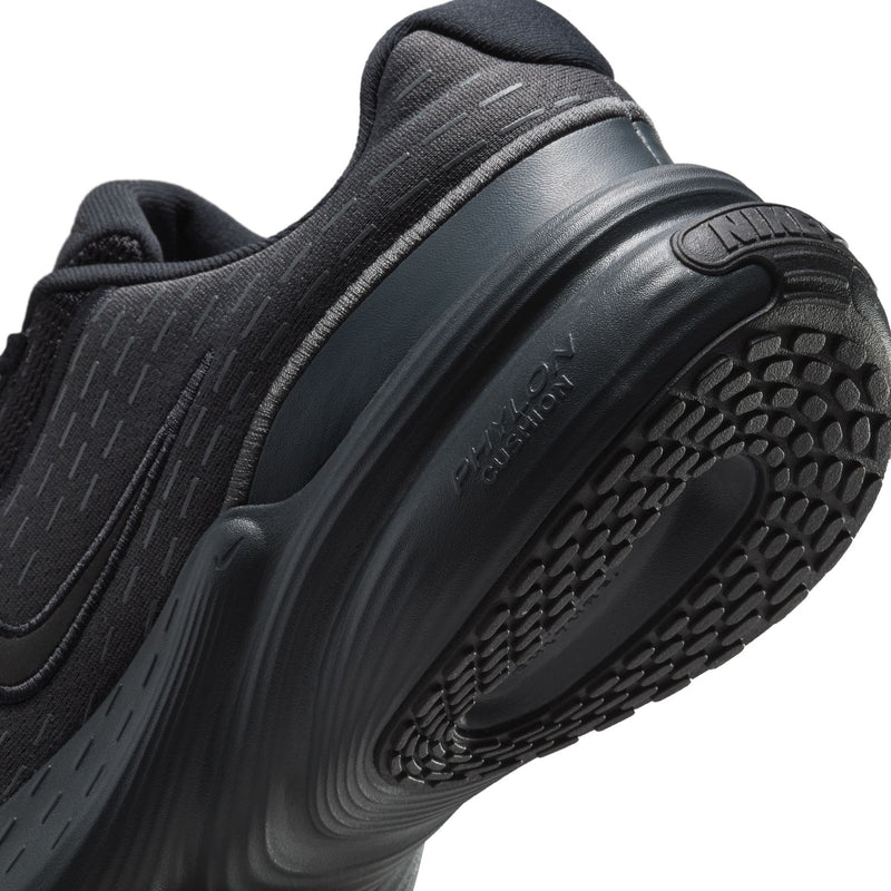 Women's black side close-up with Nike swoosh and textured outsole tread