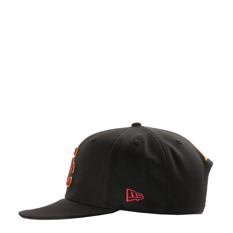 Black baseball cap back view with small red and yellow USC logo embroidery