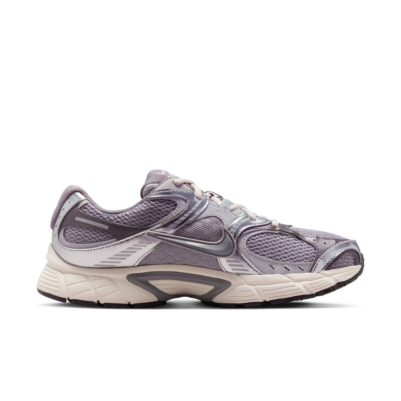 Gray Nike running sneaker with lace-up mesh upper and curved heel midsole