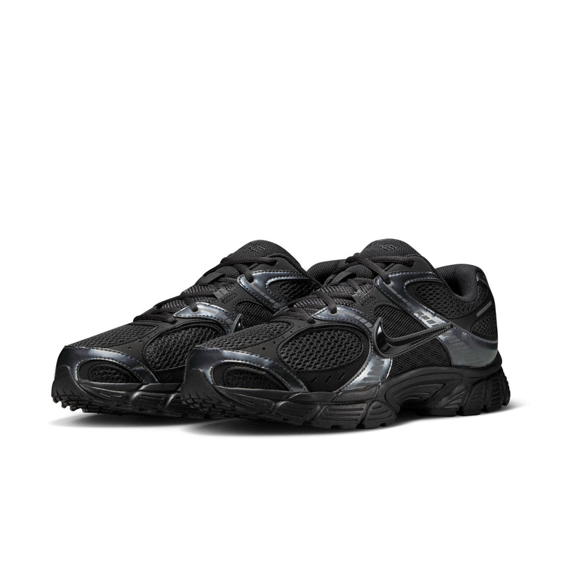 Men's black athletic sneaker with metallic quarter details, lace-up mesh, chunky sole