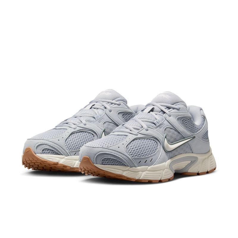 Men's light gray running shoes, side view with mesh texture, Nike swoosh, gum outsole