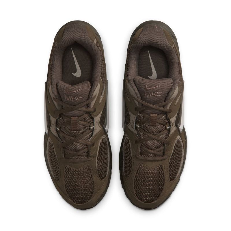 Pair of dark olive sneakers with laces and Nike logo on tongue