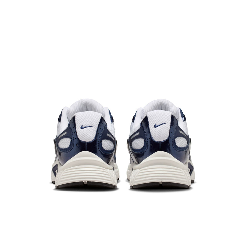 White and midnight navy sneakers with padded heel and rear NIKE swoosh