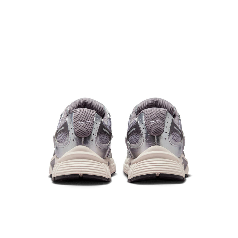 Nike running shoes in gray with lace-up front and padded rear heel