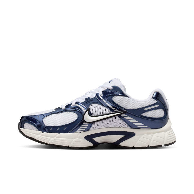 White and midnight navy running sneaker with layered panels and NIKE swoosh