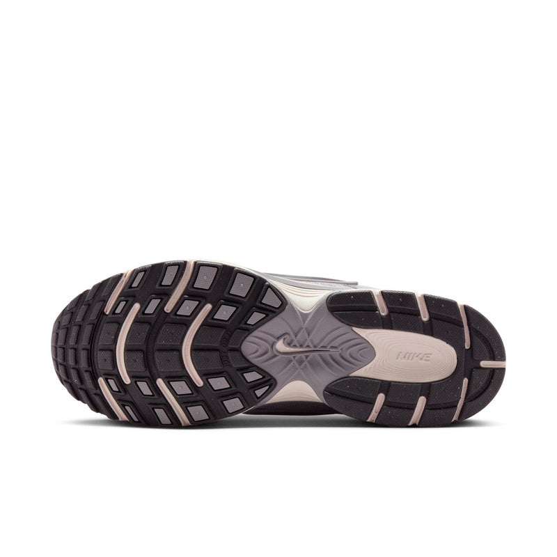 Nike running sneaker outsole with textured tread and dark heel section