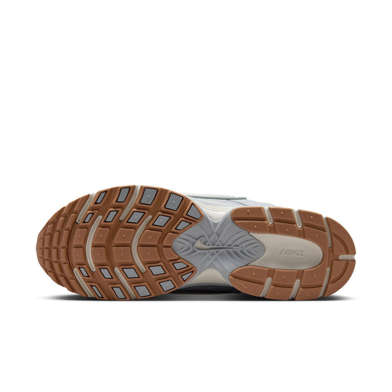 Outsole view of light gray running shoes with textured tread and gum-brown rubber