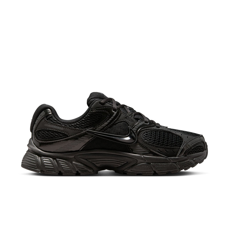 Women's black running shoe with mesh upper, lace-up, and rubber outsole tread