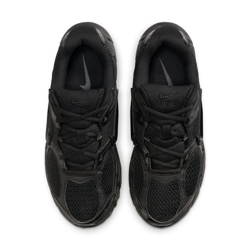 Women's black running shoe pair showing laces and mesh tongue with swoosh branding