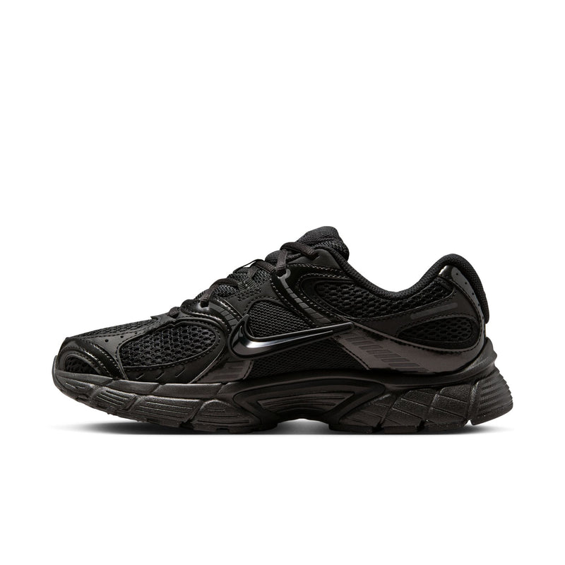 Women's black running shoe with lace-up mesh upper and molded side panels
