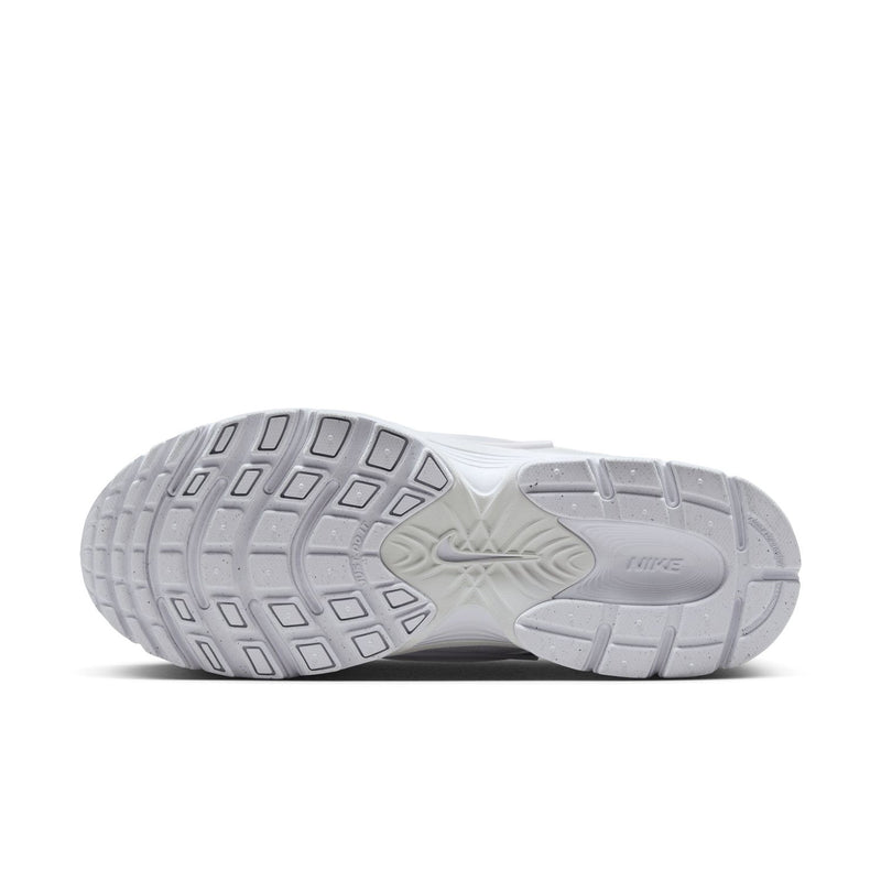 White sneaker outsole with grid tread pattern and molded brand logo