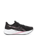 Women's black running shoes with pink accent logo and white sole