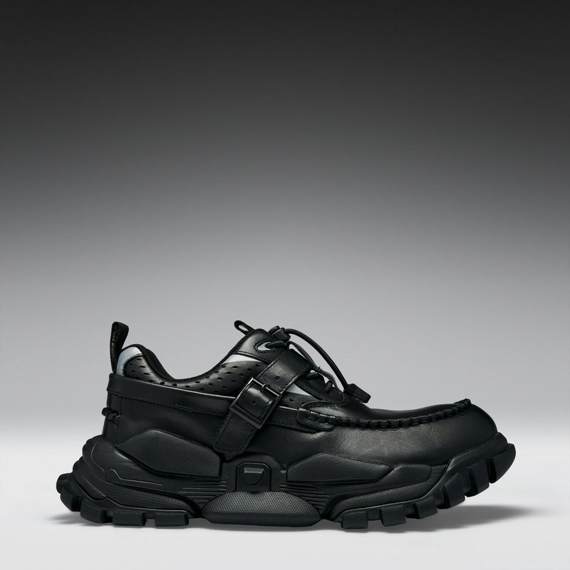 Black sneaker on a gray background