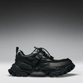 Black sneaker on a gray background