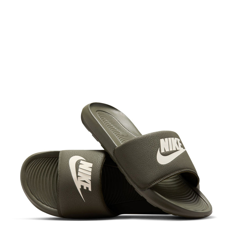 Pair of men's dark olive slide sandals with white Nike swoosh on straps