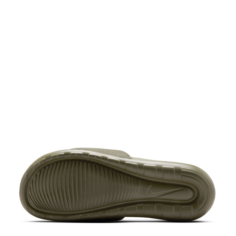 Men's dark olive slide sandal outsole with textured tread and curved edge