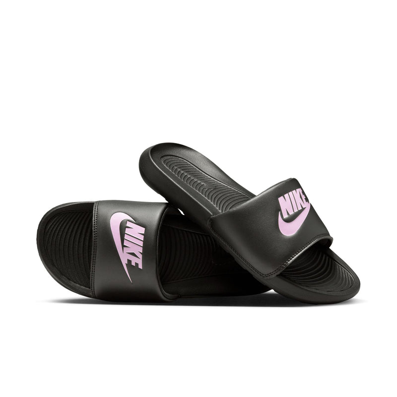 Women's black Nike slides with light pink logos on the wide foot strap