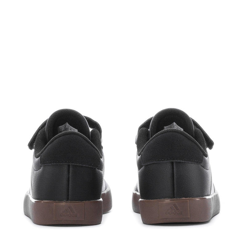 Kids' black sneakers back view with Velcro strap detail and gum heel tab