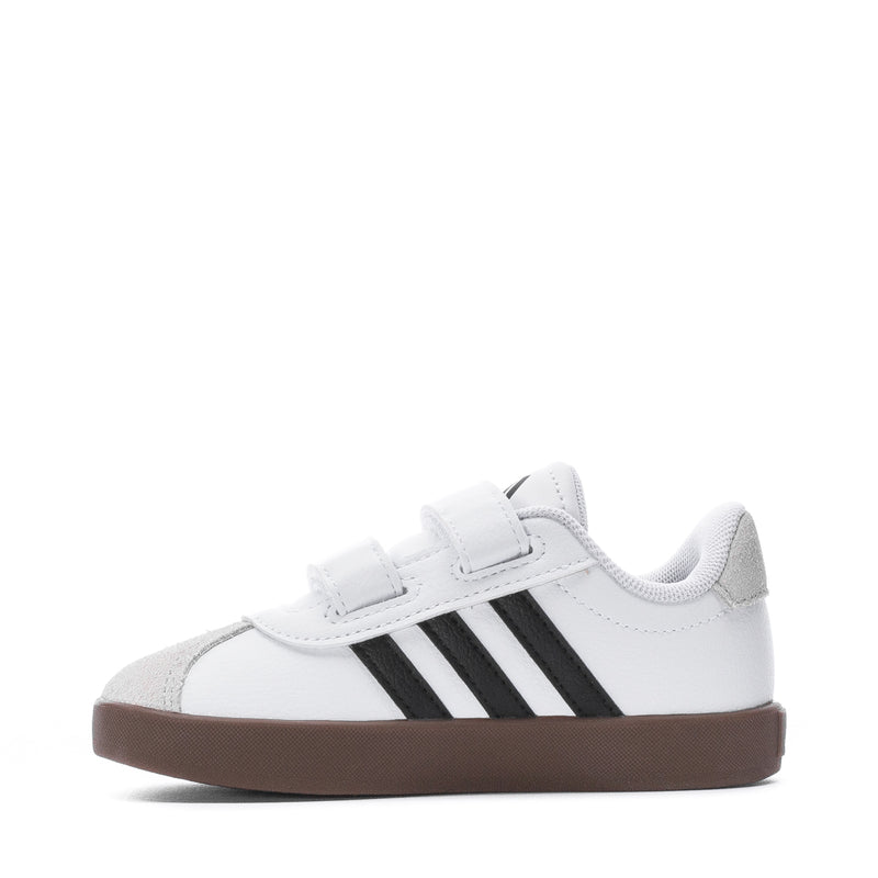 White toddler sneakers with two black side stripes and brown rubber sole, Velcro strap
