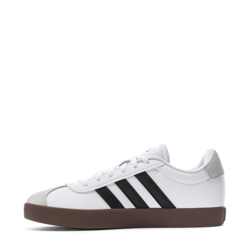 Youth adidas sneakers, side view: white upper, black stripes, gum sole