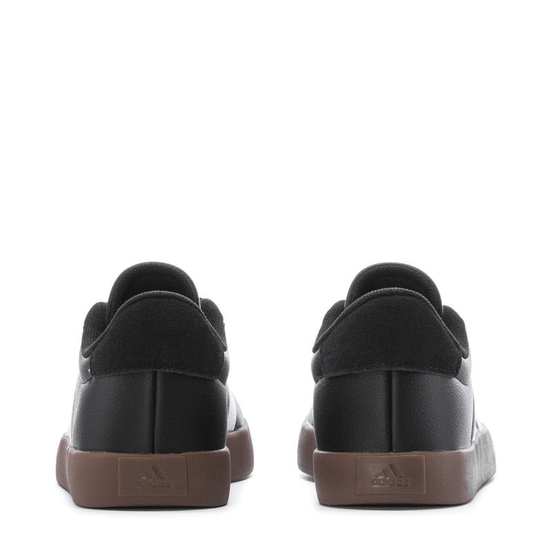 Black youth sneakers with rounded heel, gum-brown outsole and back pull tab