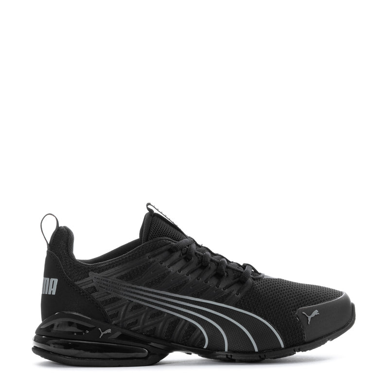Youth black Puma sneakers with gray stripe detailing, lace-up and cushioned sole