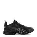 Youth black Puma sneakers with gray stripe detailing, lace-up and cushioned sole
