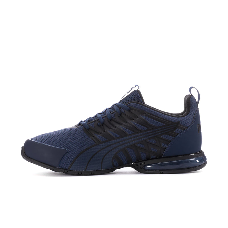 Navy low-top sneakers with lace-up closure, stitched stripes, and cushioned sole