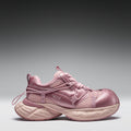Pink athletic shoe on a gray background