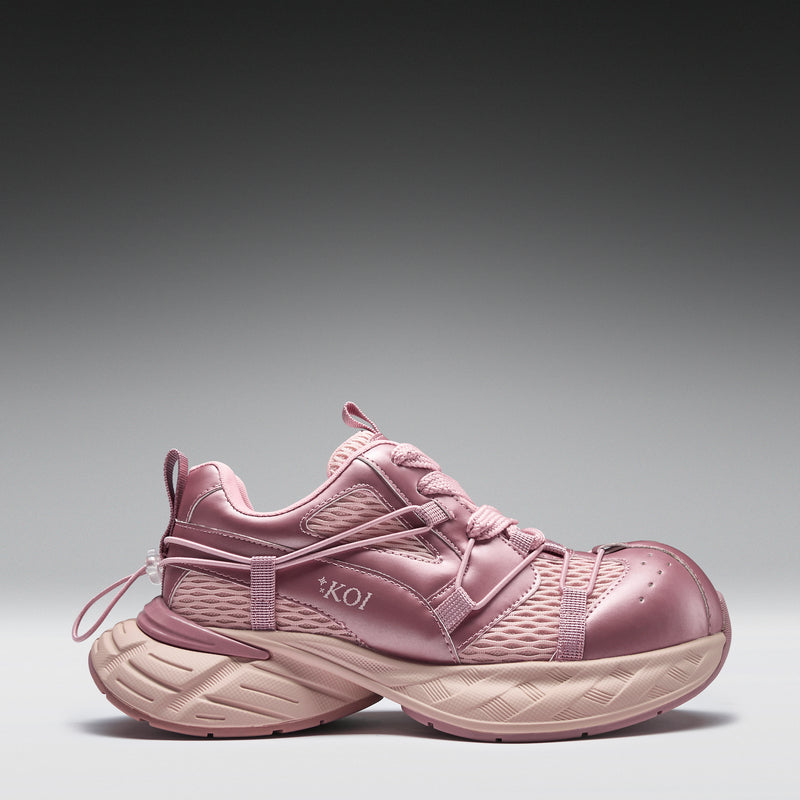 Pink athletic shoe on a gray background
