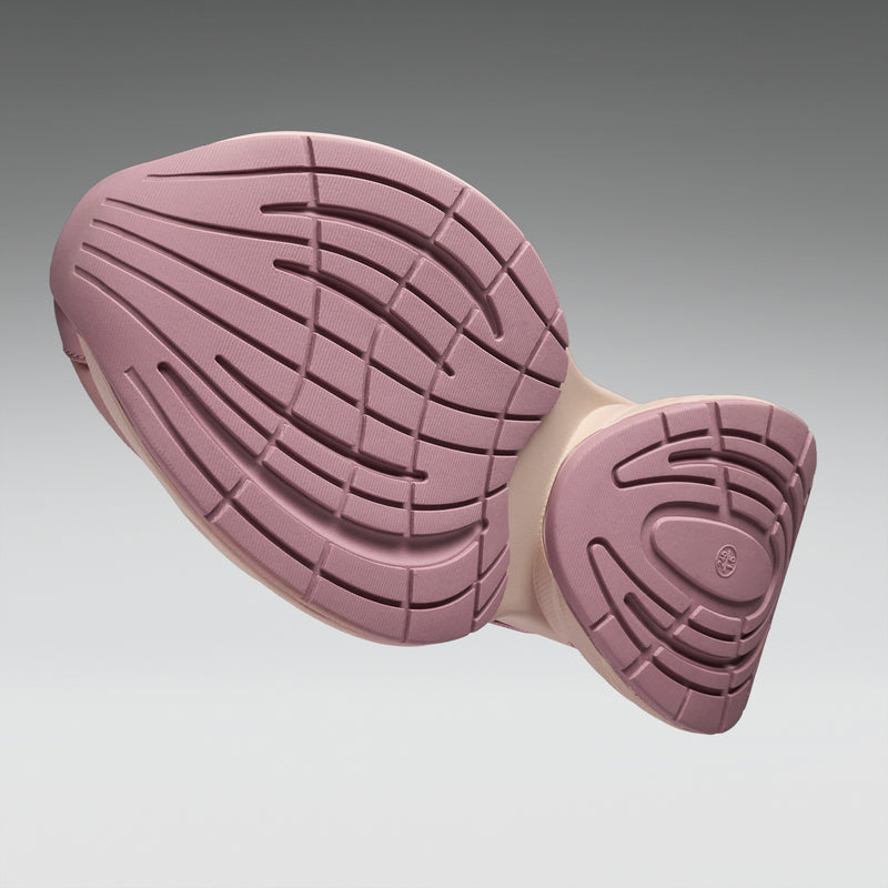 Purple sole of a shoe on a gray background