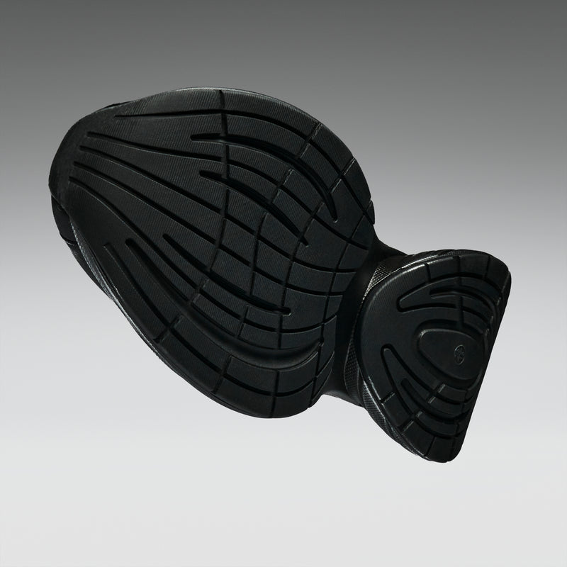 Black rubber mat with textured surface on a gray background