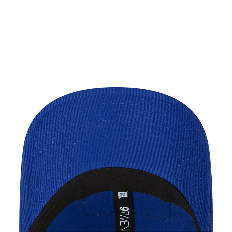 Blue 9TWENTY trucker cap interior label visible under the brim.