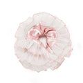 Pink and white ruffled headband with a bow on a white background