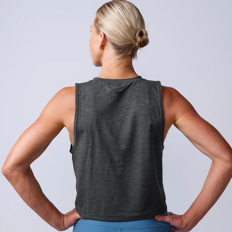 Woman wearing a dark sleeveless GORUCK training tank, shown from the back.