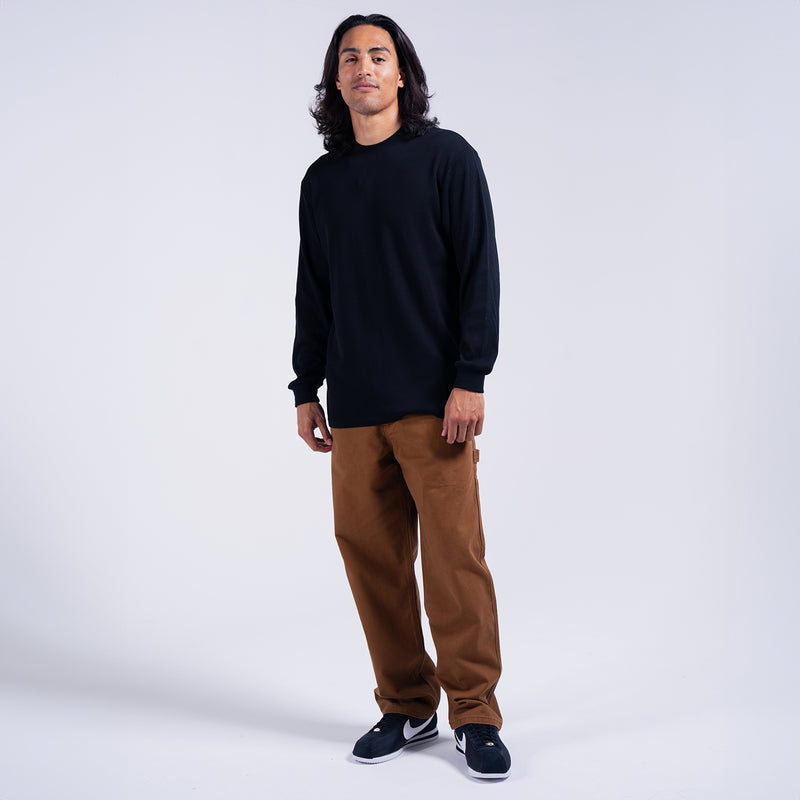 Men's brown work pants on model, straight-leg with side pockets