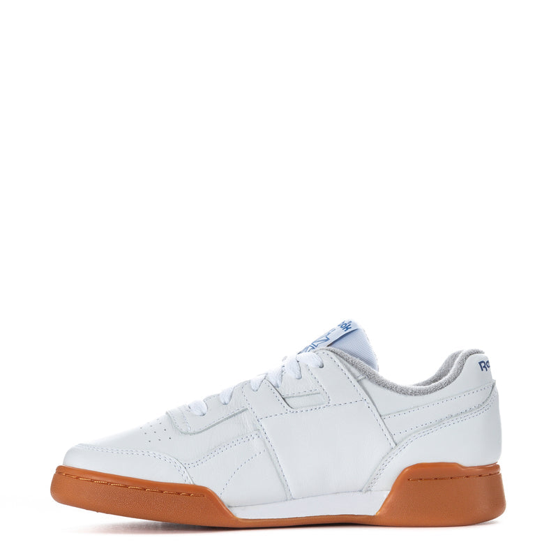 Women’s Reebok low-top sneakers, white upper with orange gum sidewall and sole