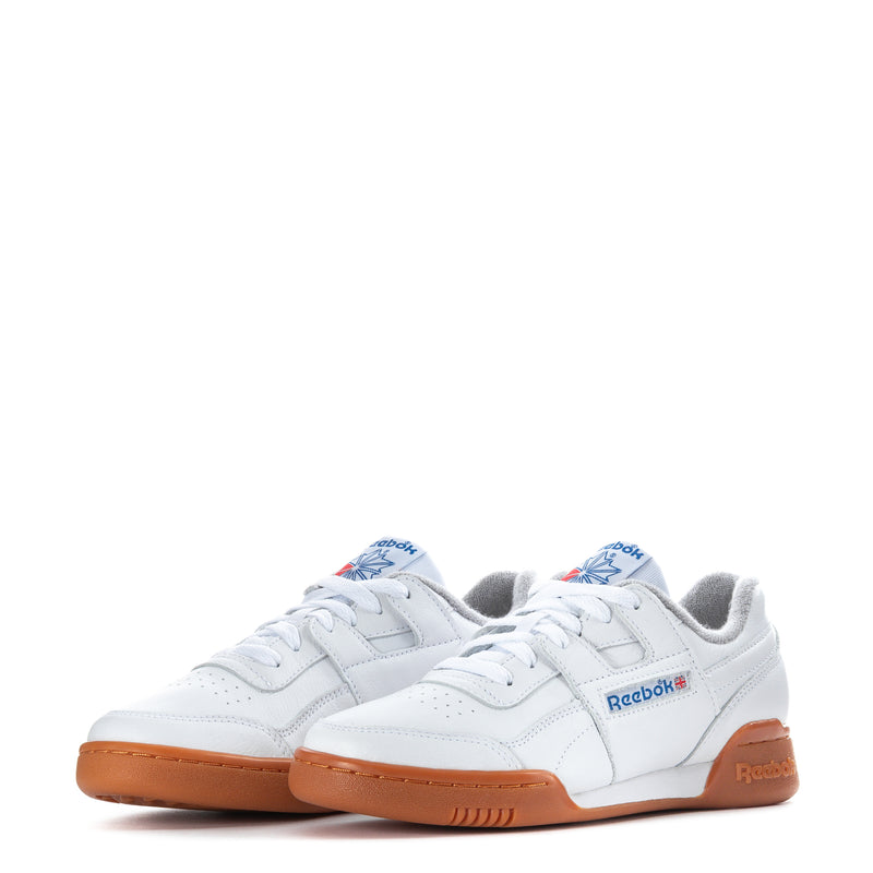 Women’s Reebok sneakers, white leather with orange gum sole; lace-up front view