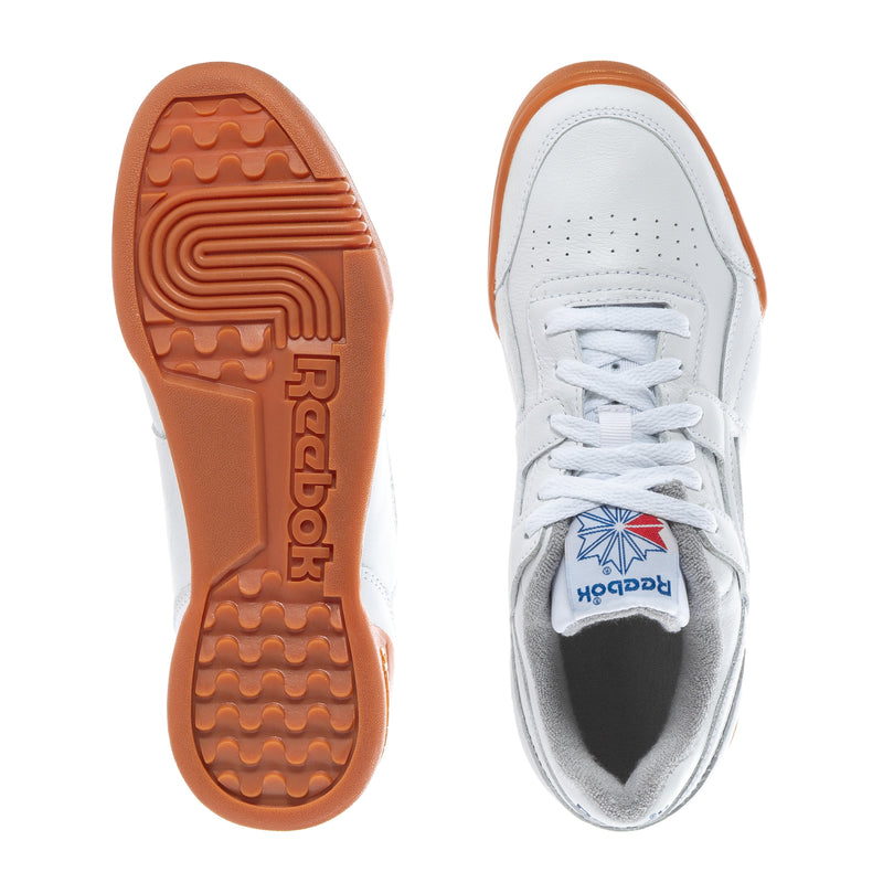 Women’s Reebok sneakers: outsole view and white upper with orange gum heel