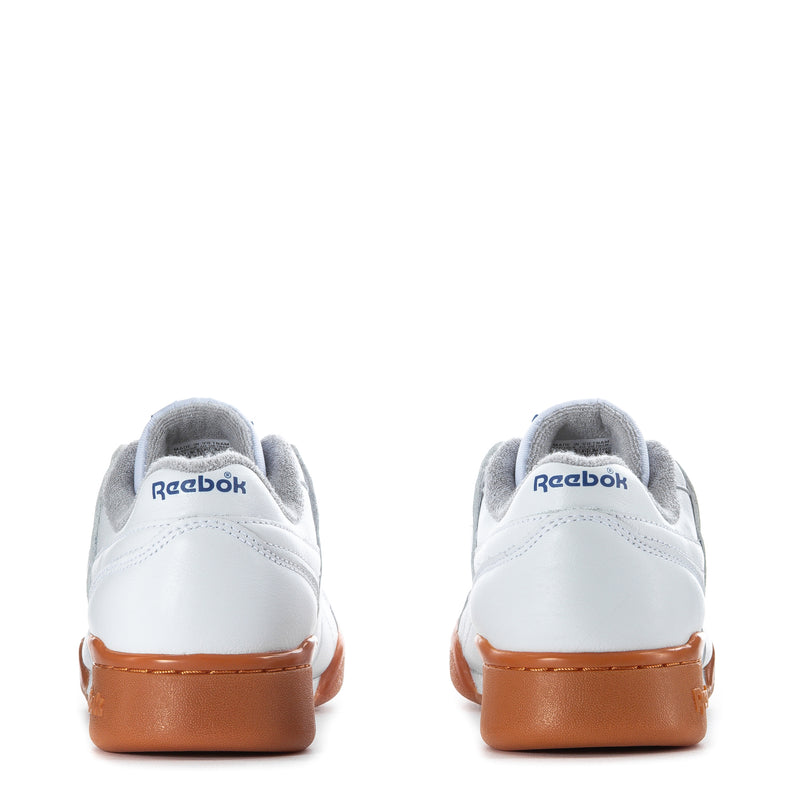 Women’s Reebok sneakers back view, white uppers with orange heel panel