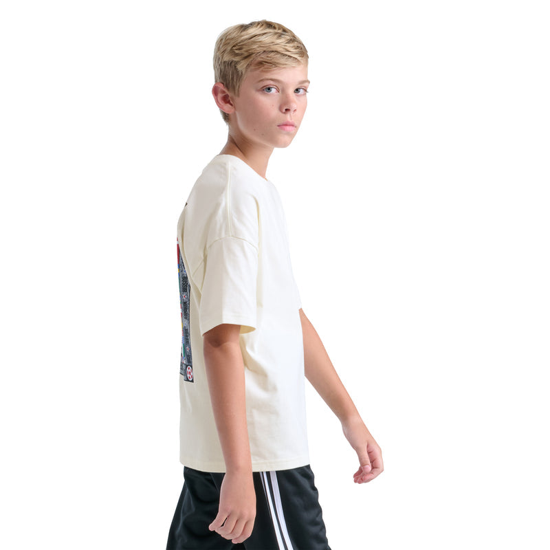 Off-white youth crewneck tee with small chest trefoil and colorful sleeve patch